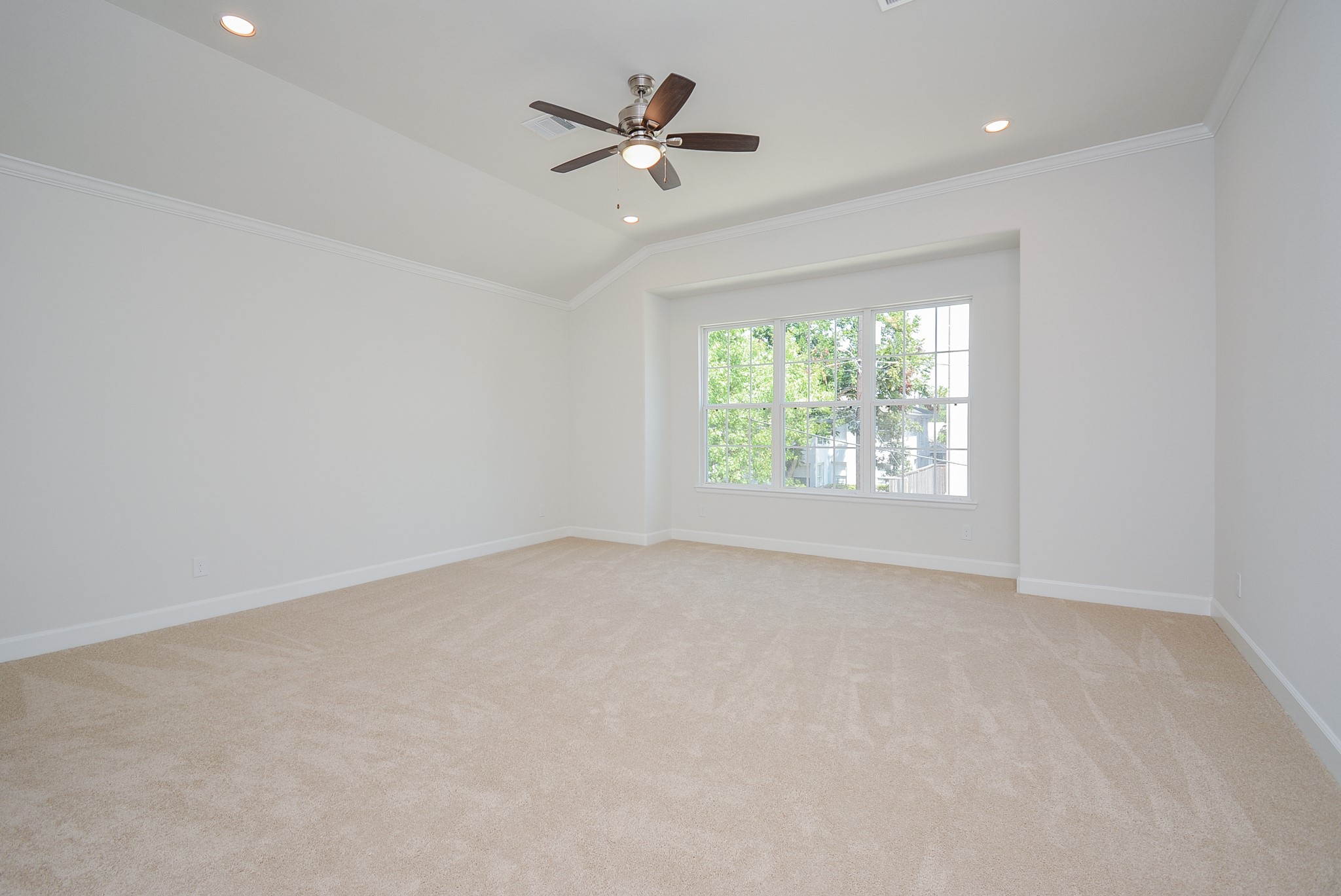 1847 Sul Ross Street Houston, TX 77098 - Photo 19 of 42 an empty room with a window and a fan