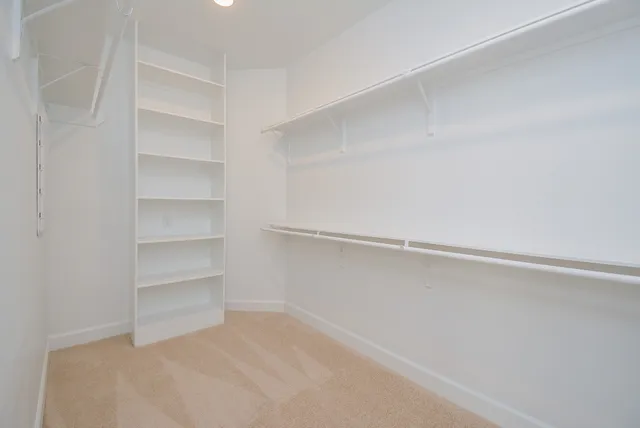 a view of an empty walk in closet