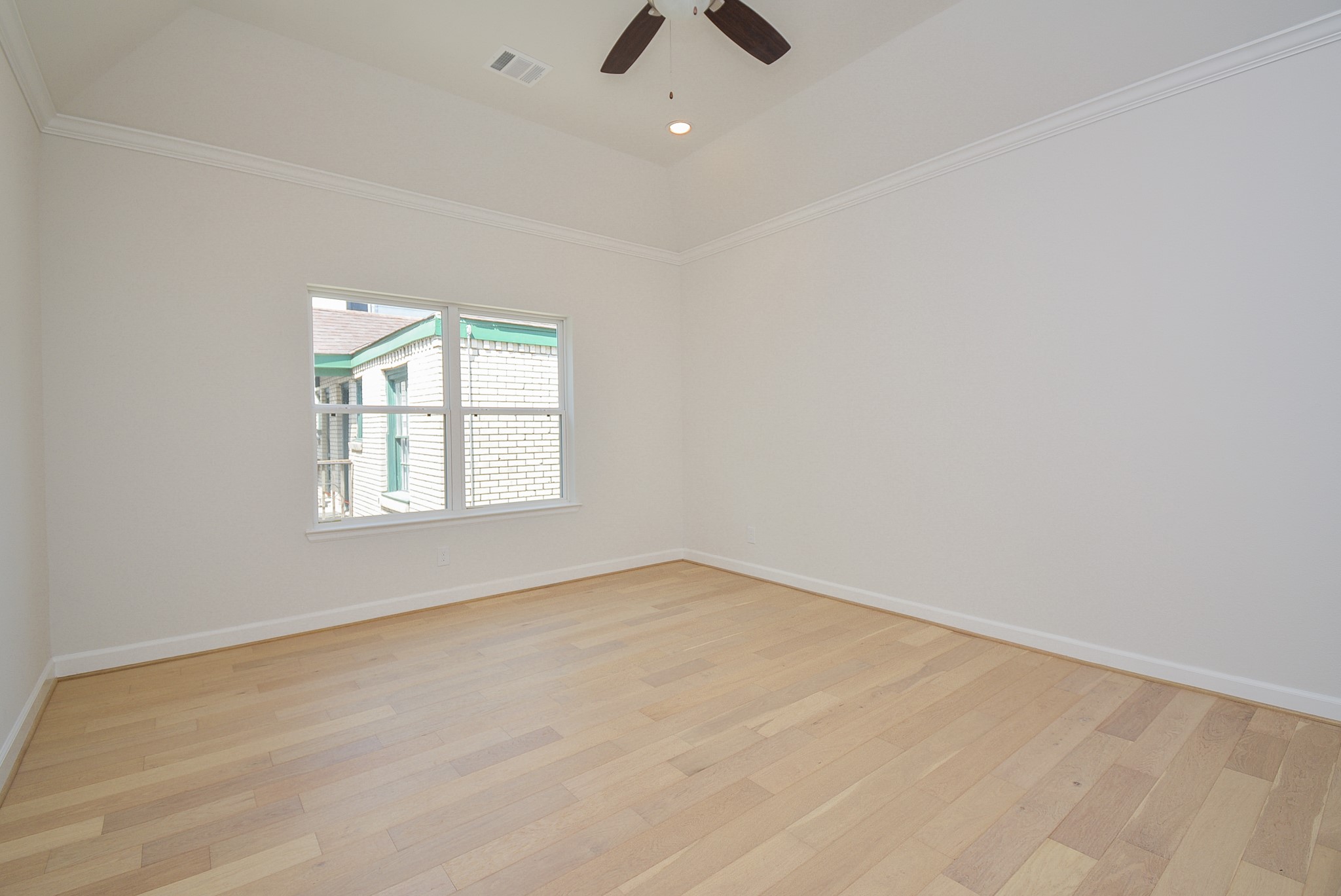 1847 Sul Ross Street Houston, TX 77098 - Photo 30 of 42 an empty room with chandelier fan and windows