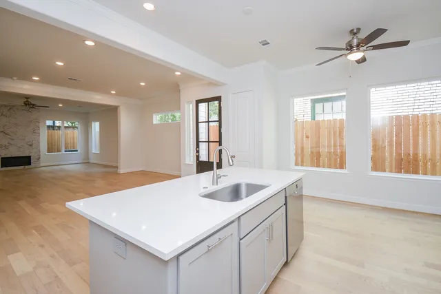 a kitchen with sink and window