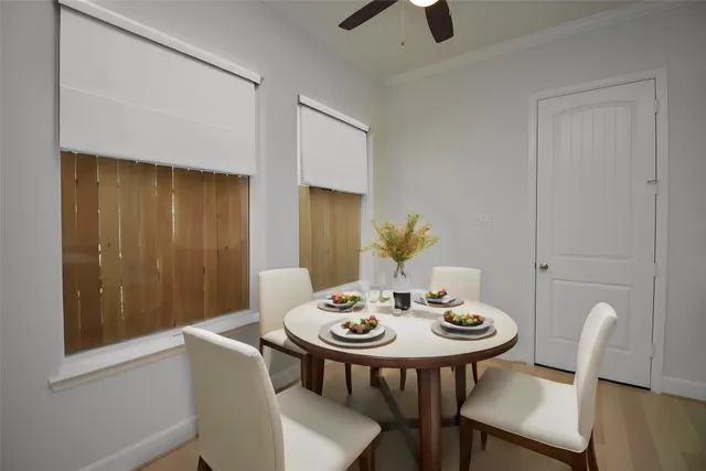 a view of a dining room with furniture and wooden floor