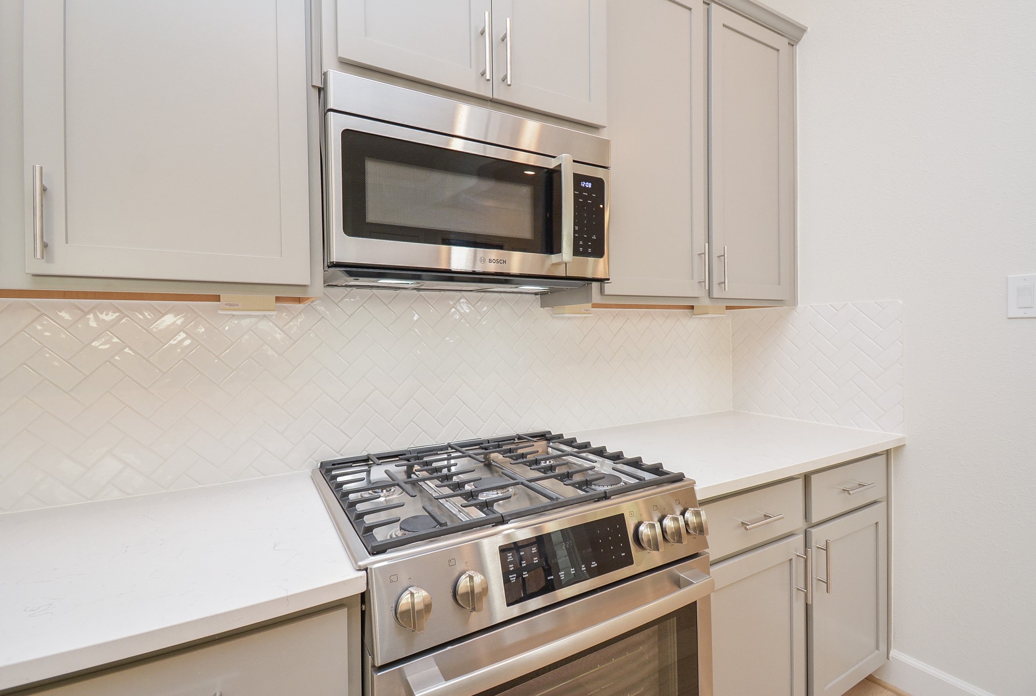 1847 Sul Ross Street Houston, TX 77098 - Photo 8 of 42 a stove top oven sitting inside of a kitchen