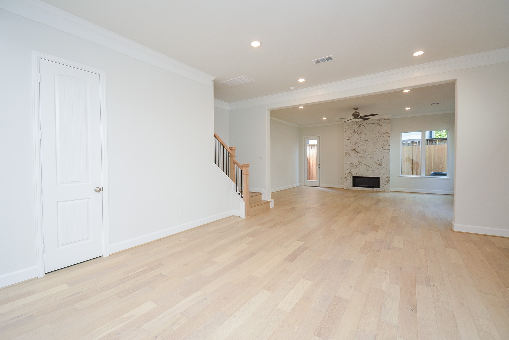 1847 Sul Ross Street Houston, TX 77098 - Photo 10 of 42 a view of a big room with wooden floor and windows