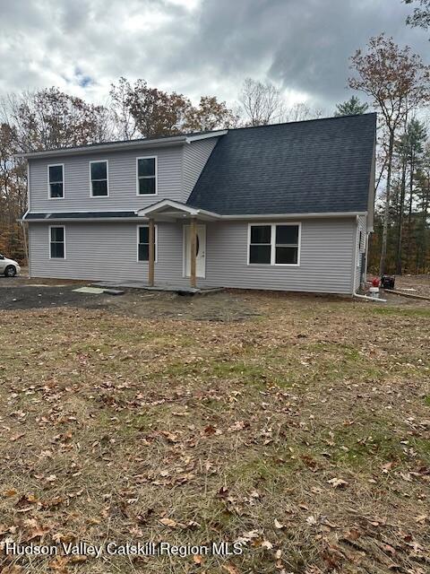 front view of house with a yard