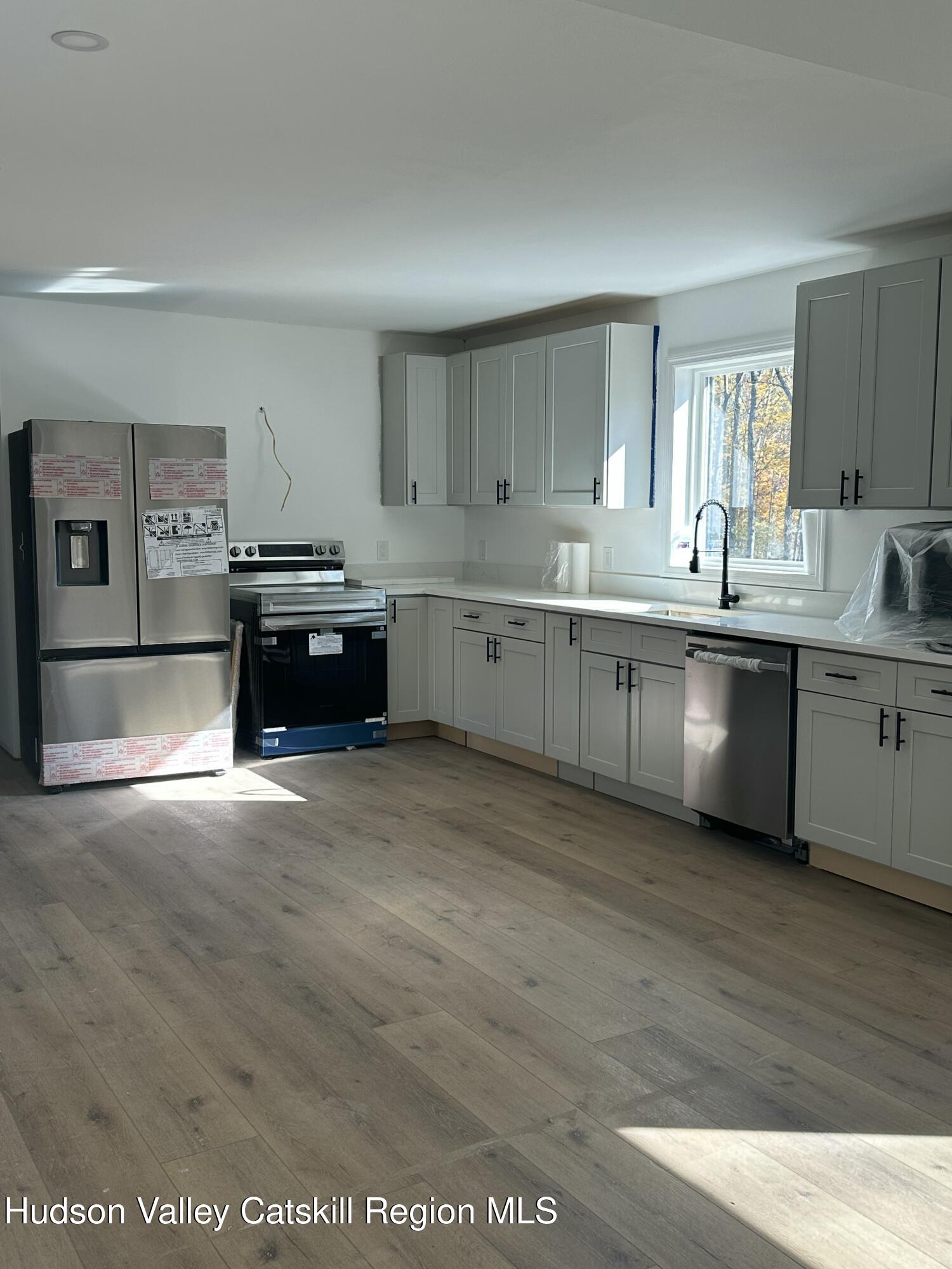 20 Olivers Way Cairo, NY 12413 - Photo 4 of 15 a kitchen with sink and cabinets