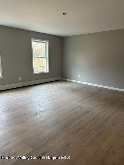 20 Olivers Way Cairo, NY 12413 - Photo 6 of 15 an empty room with wooden floor and windows