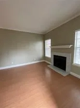 a view of empty room with a fireplace