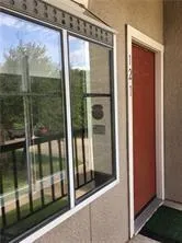 a view of a glass door and a window