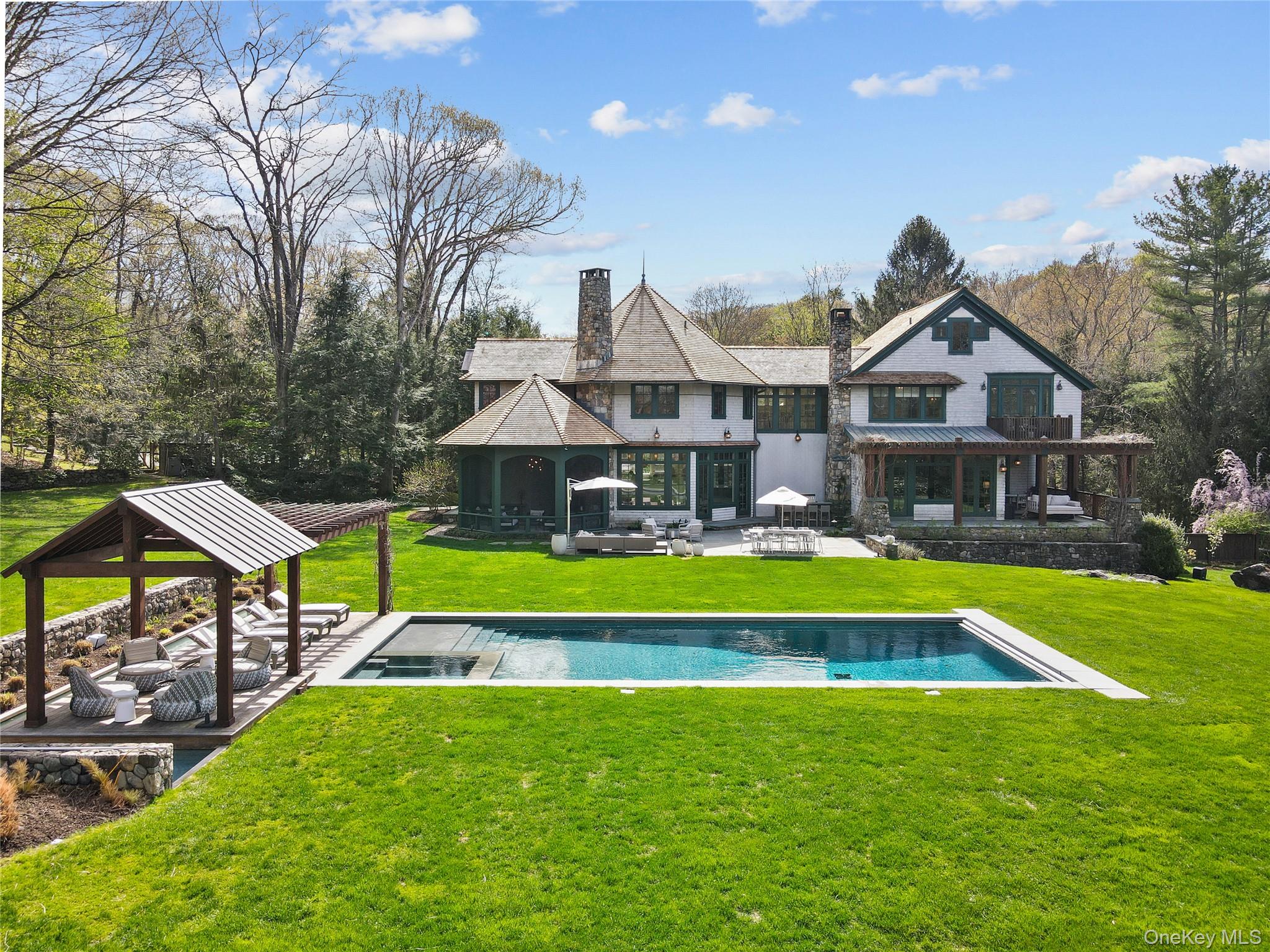 10 Upland Road North Bedford, NY 10506 - Photo 1 of 36 a house with swimming pool in front of it
