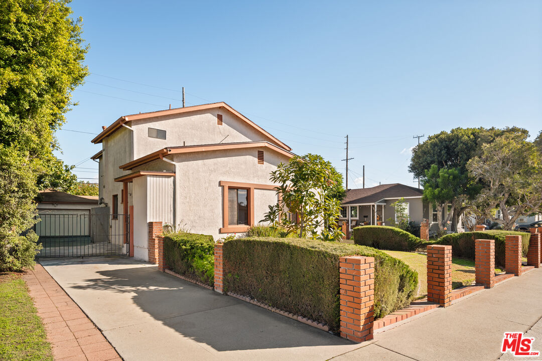 8710 El Manor Avenue, Unit 1 Los Angeles, CA 90045 - Photo 12 of 12 a front view of a house with a yard