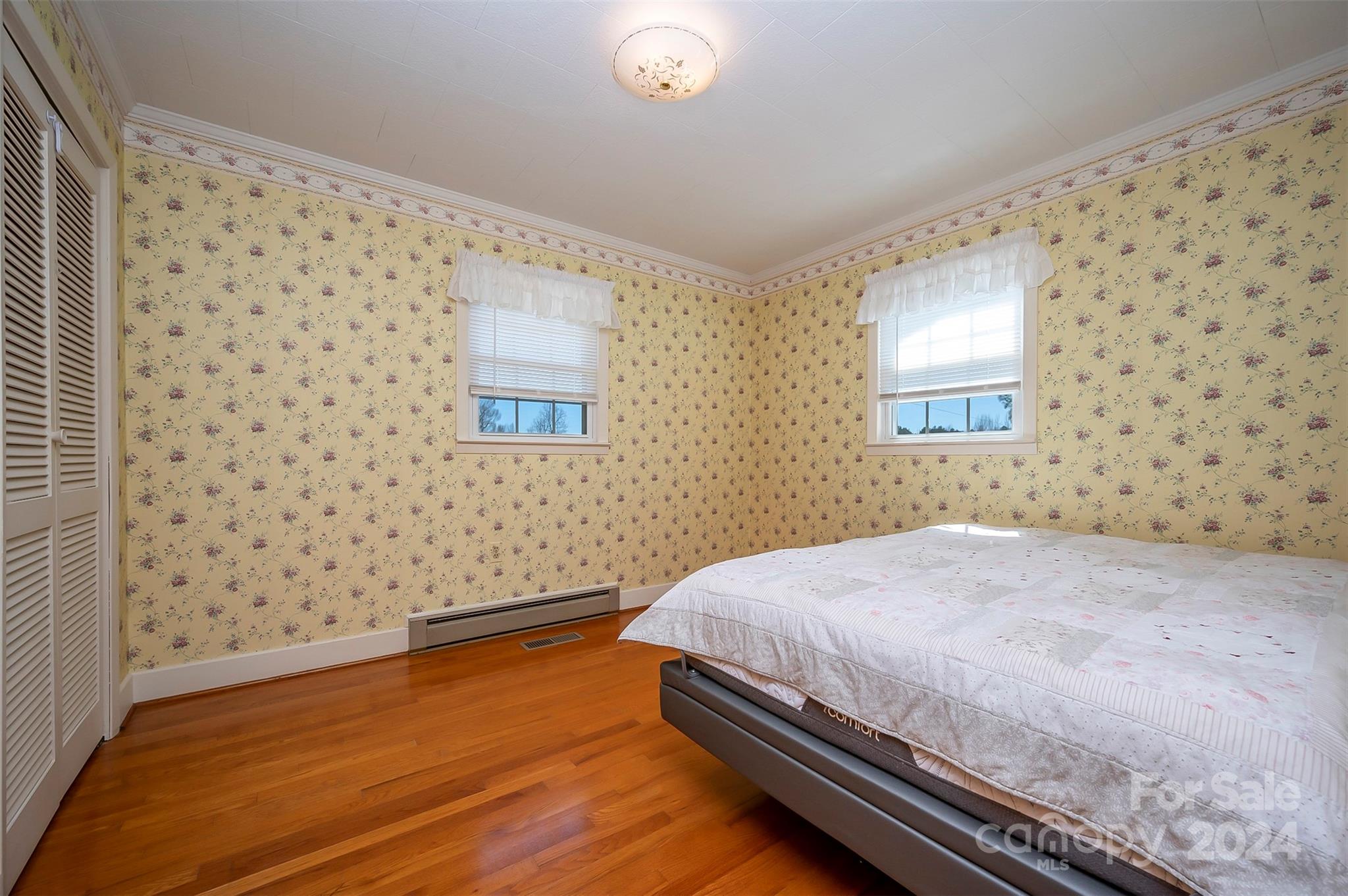 2510 Moore Road Mill Spring, NC 28756 - Photo 19 of 48 a bedroom with a bed and a window