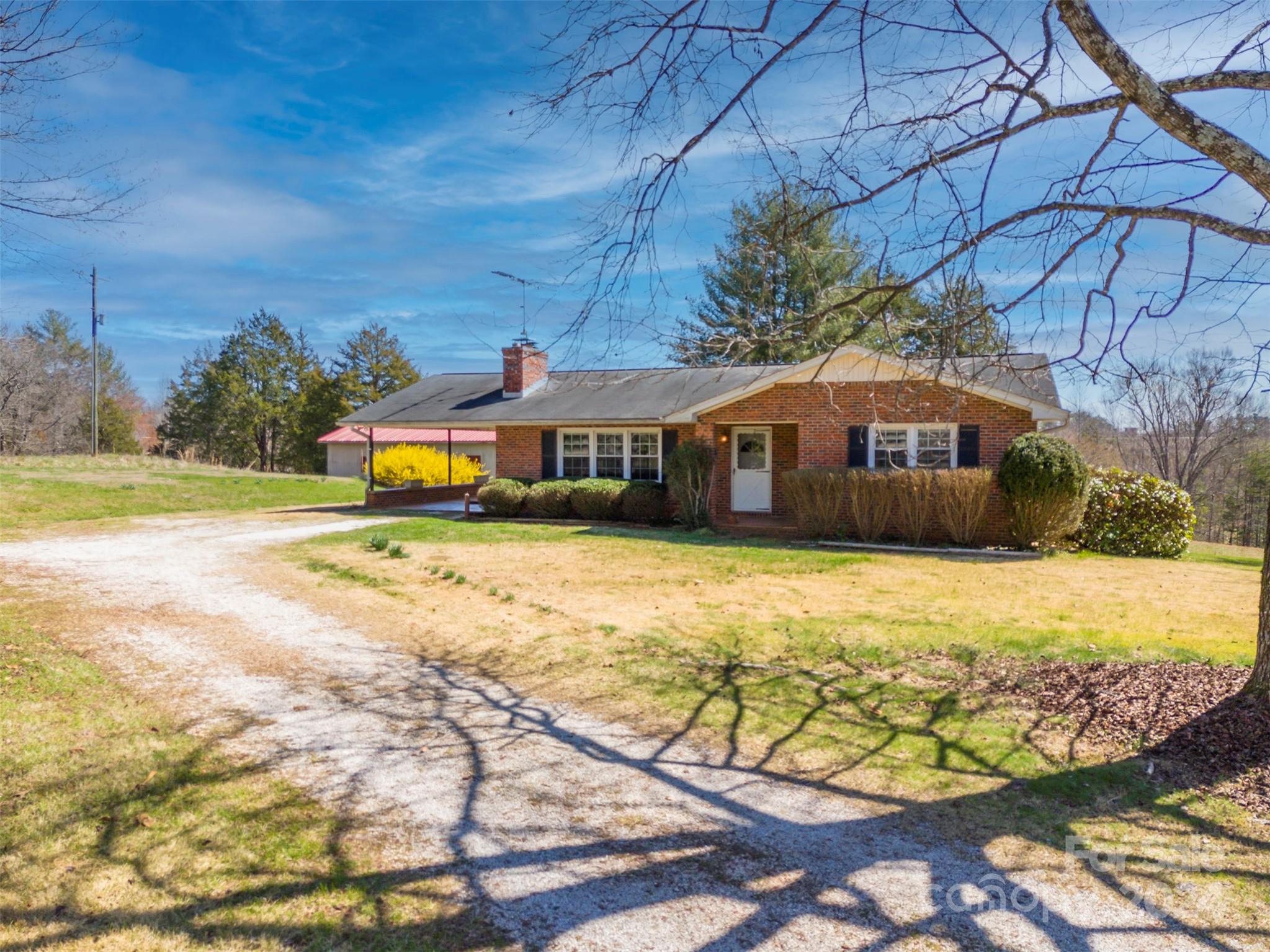 2510 Moore Road Mill Spring, NC 28756 - Photo 5 of 48 a house with swimming pool in front of it