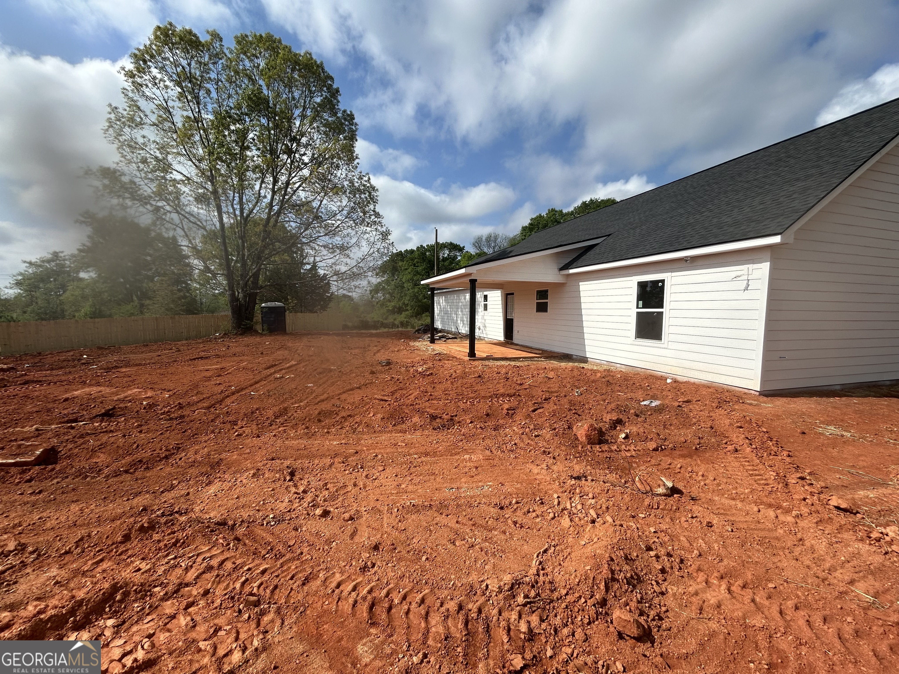 65 Pleasant Grove Road Yatesville, GA 31097 - Photo 11 of 14 a backyard of a house with large trees