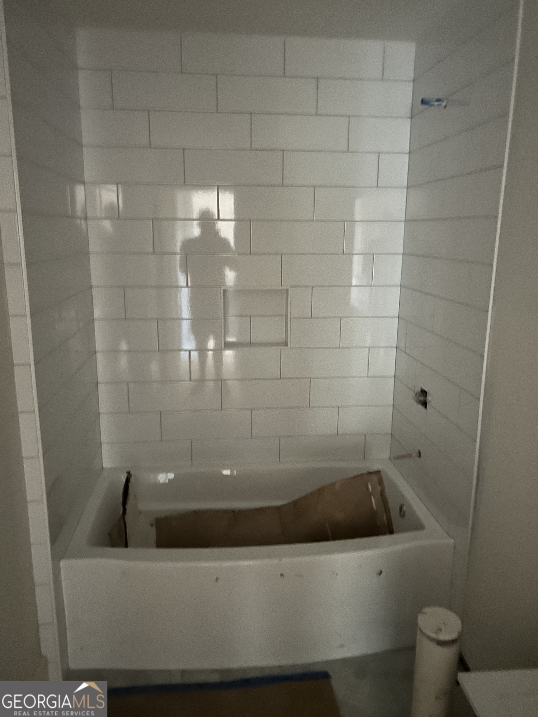 65 Pleasant Grove Road Yatesville, GA 31097 - Photo 14 of 14 a bathroom with a bathtub and toilet