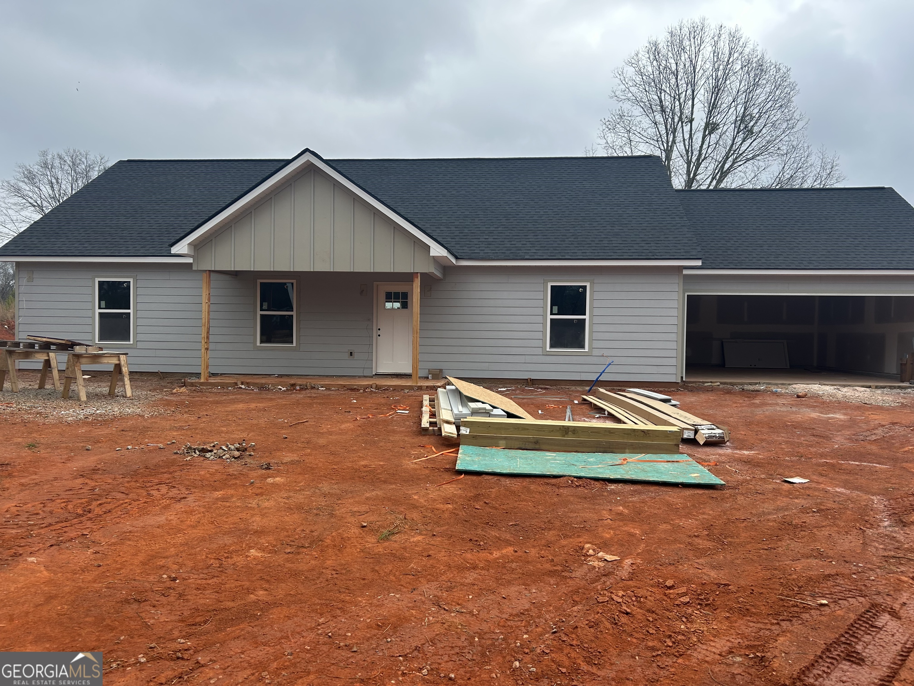 65 Pleasant Grove Road Yatesville, GA 31097 - Photo 5 of 14 a backyard of a house with table and chairs