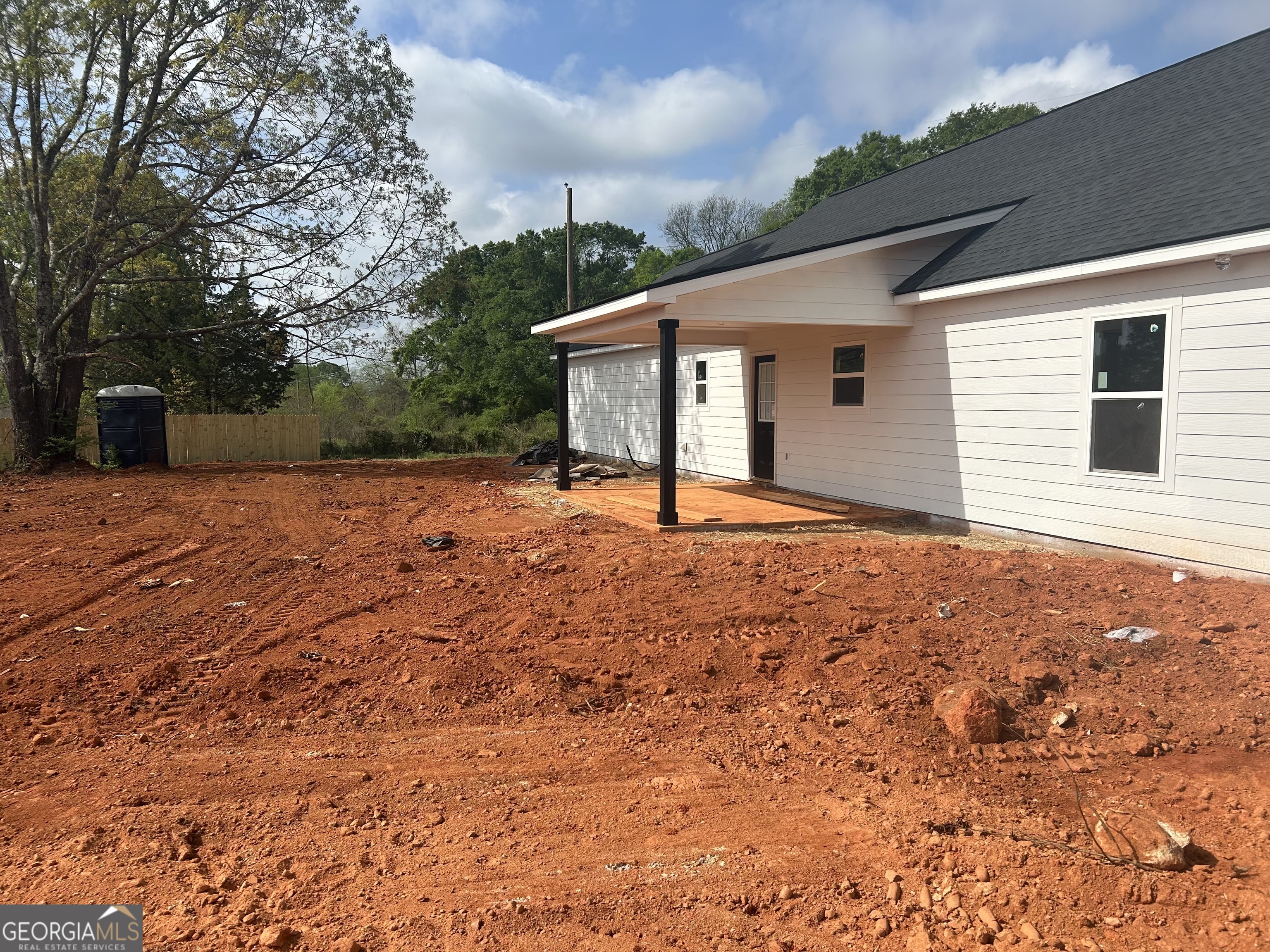 65 Pleasant Grove Road Yatesville, GA 31097 - Photo 8 of 14 a backyard of a house with large trees