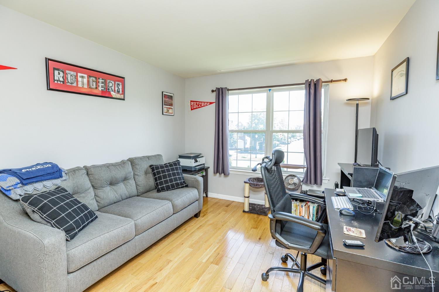 307 Lilac Drive Union, NJ 07083 - Photo 18 of 25 a living room with furniture and a floor to ceiling window
