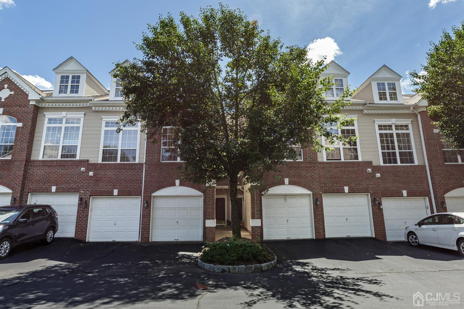 307 Lilac Drive Union, NJ 07083 - Photo 25 of 25 a front view of a house with a yard and garage