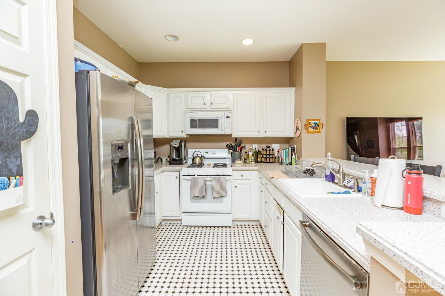 307 Lilac Drive Union, NJ 07083 - Photo 5 of 25 a kitchen with a sink stove and refrigerator