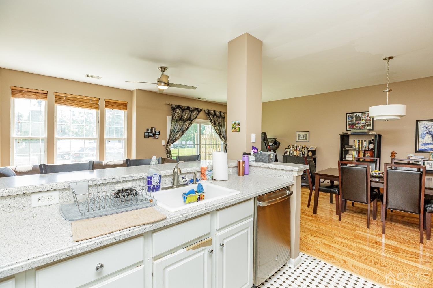 307 Lilac Drive Union, NJ 07083 - Photo 8 of 25 a kitchen with sink cabinets and dining table