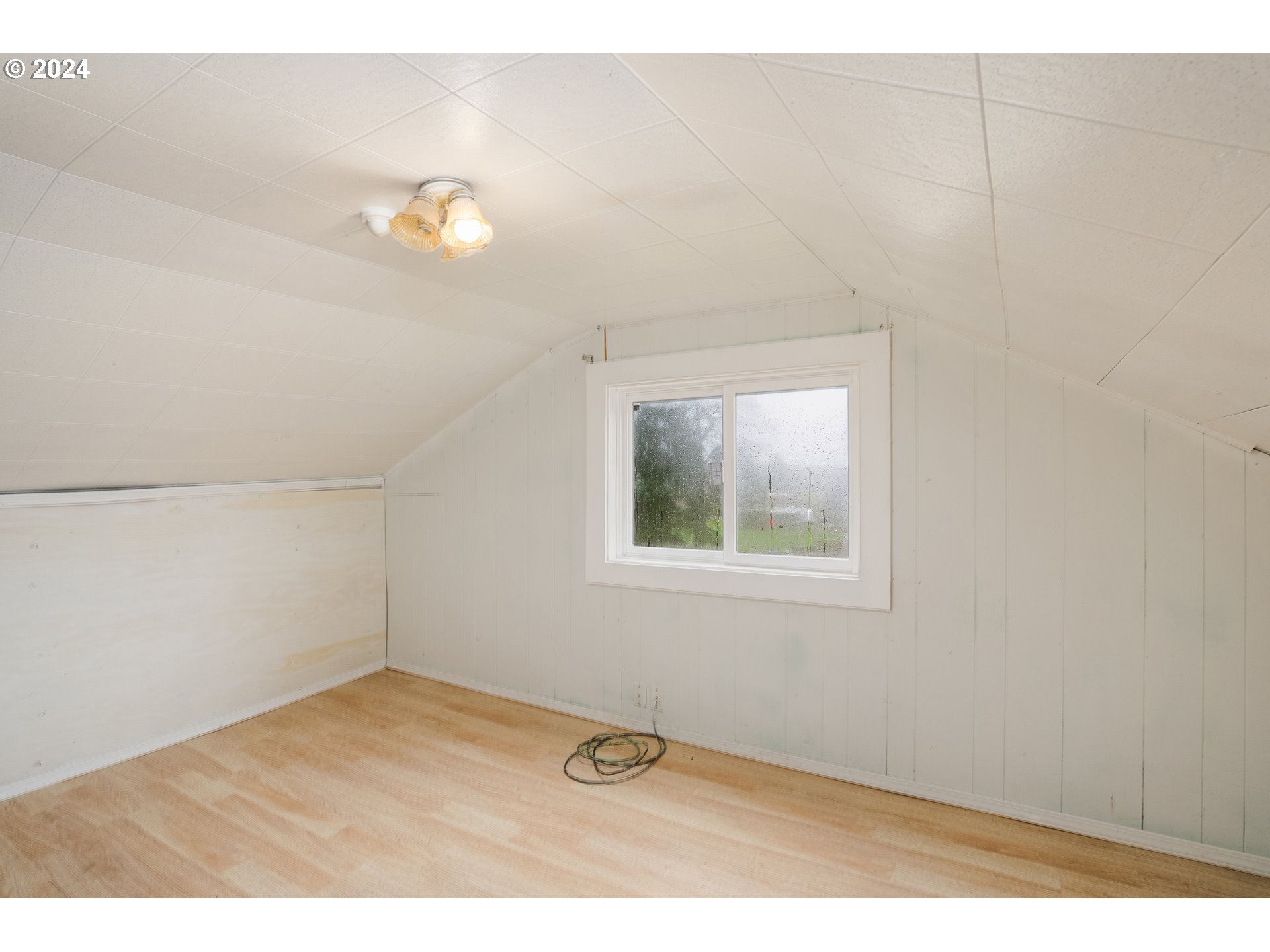 30356 South Grays Hill Road Colton, OR 97017 - Photo 17 of 27 an empty room with wooden floor and windows