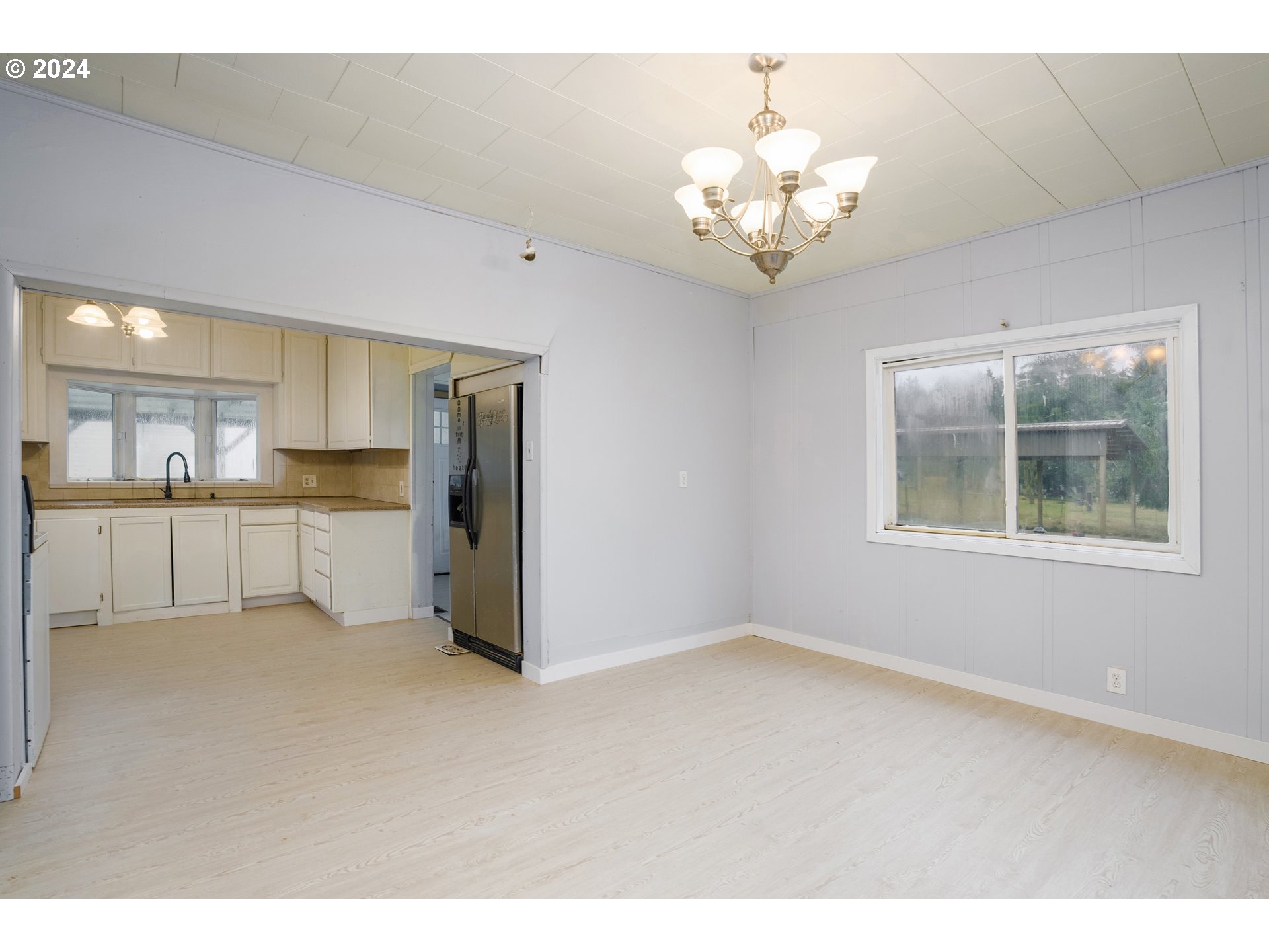 30356 South Grays Hill Road Colton, OR 97017 - Photo 10 of 27 a view of a kitchen with a sink cabinets and a window
