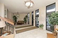 a view of hall way with furniture