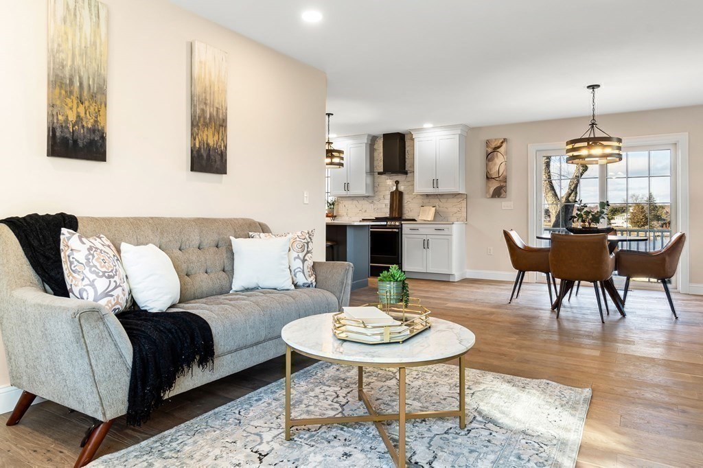 59 Riverview Avenue Danvers, MA 01923 - Photo 12 of 30 a living room with furniture and a table