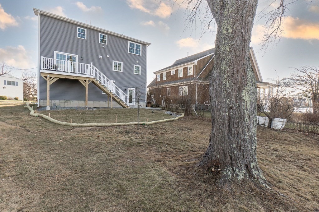 59 Riverview Avenue Danvers, MA 01923 - Photo 22 of 30 a view of a house with a yard