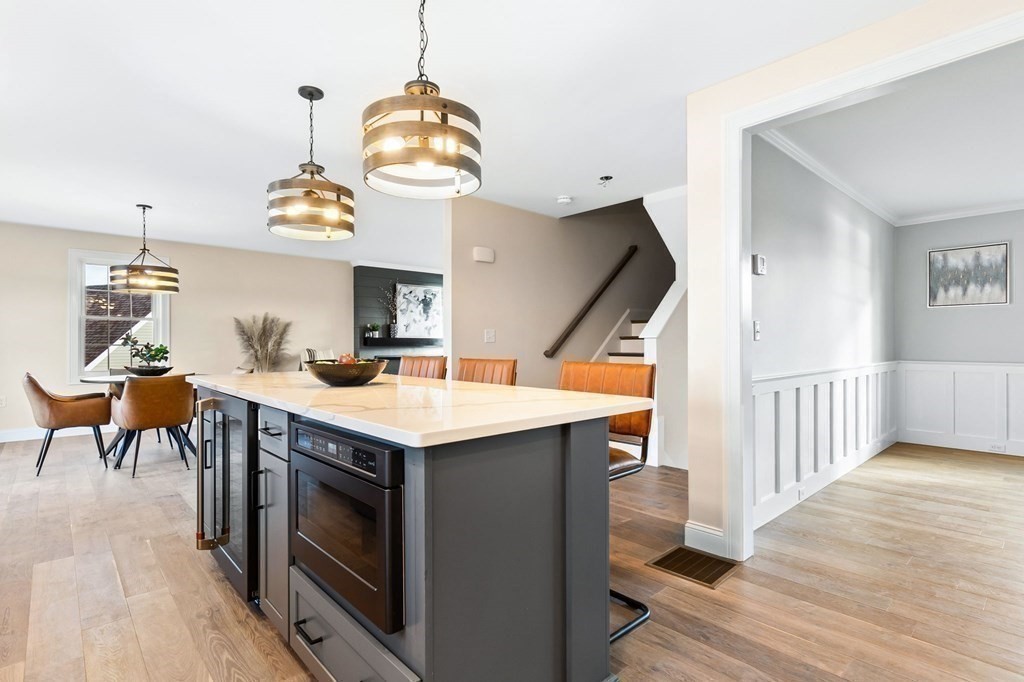 59 Riverview Avenue Danvers, MA 01923 - Photo 5 of 30 a kitchen with a sink a stove and chairs