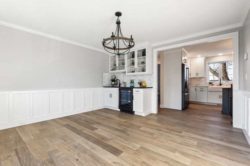59 Riverview Avenue Danvers, MA 01923 - Photo 9 of 30 a view of a kitchen with wooden floor and a kitchen