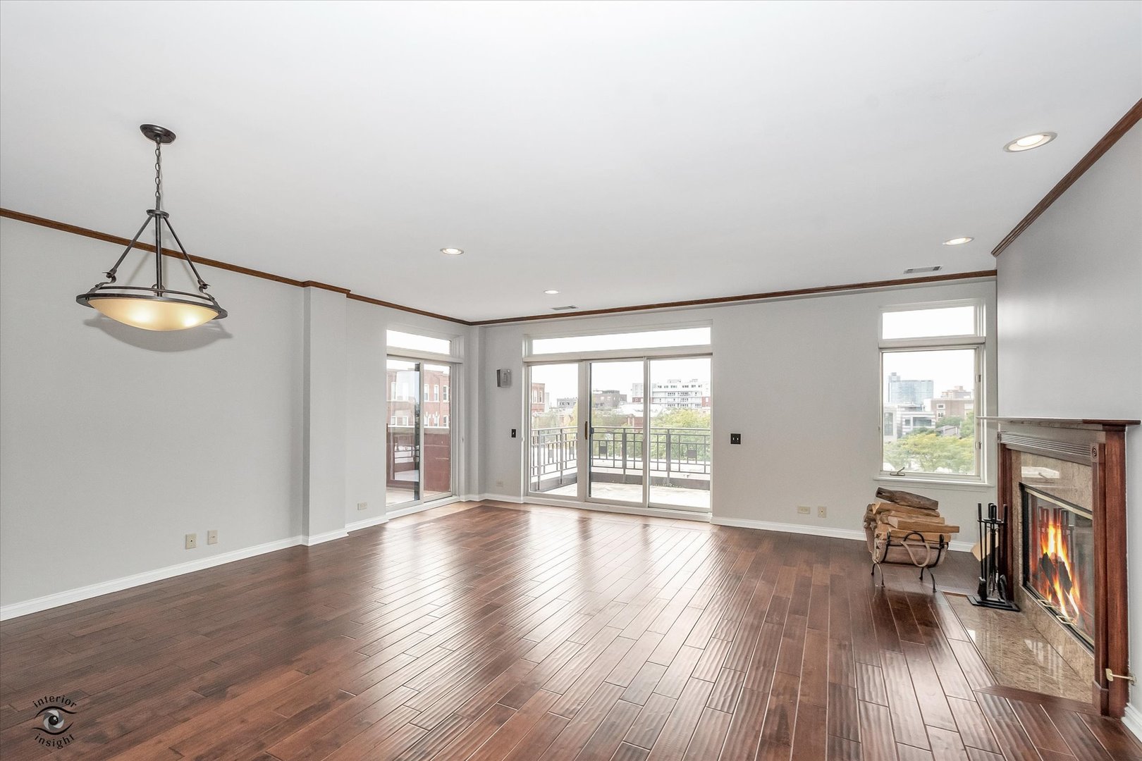 1414 North Wells Street, Unit 508 Chicago, IL 60610 - Photo 2 of 28 a view of an empty room with wooden floor and a window