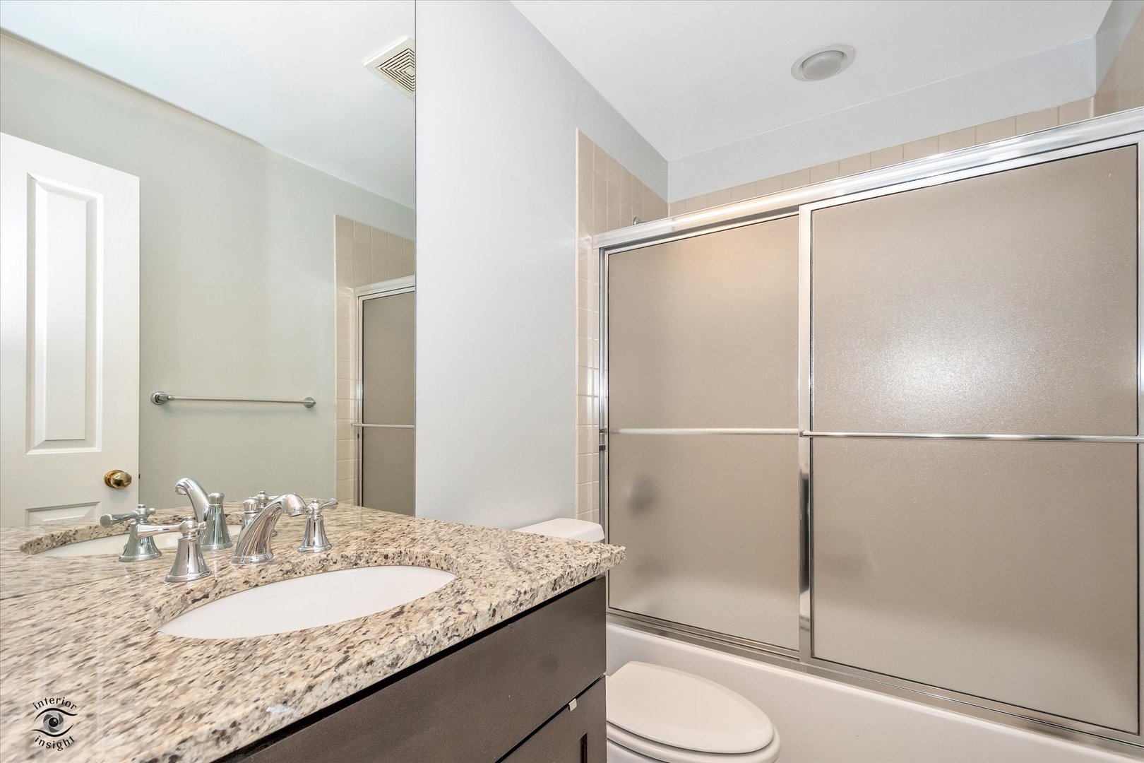 1414 North Wells Street, Unit 508 Chicago, IL 60610 - Photo 23 of 28 a bathroom with a granite countertop sink toilet and shower