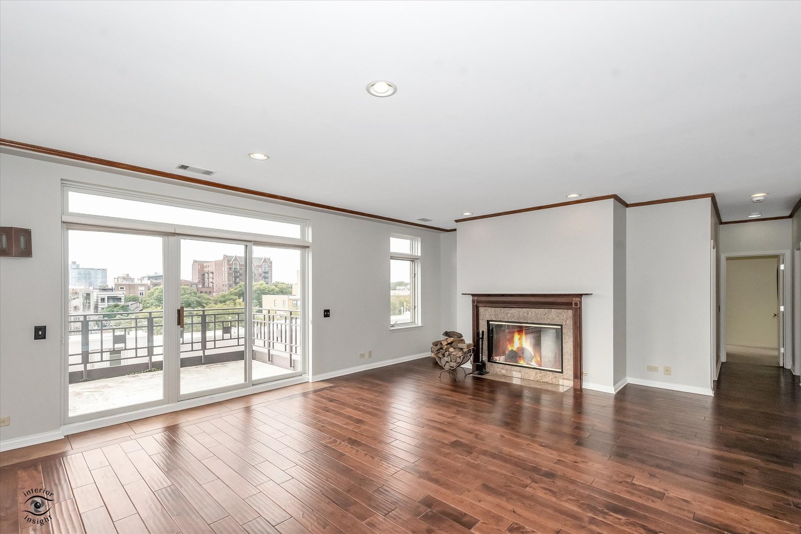 1414 North Wells Street, Unit 508 Chicago, IL 60610 - Photo 3 of 28 a living room with a fireplace and wooden floor