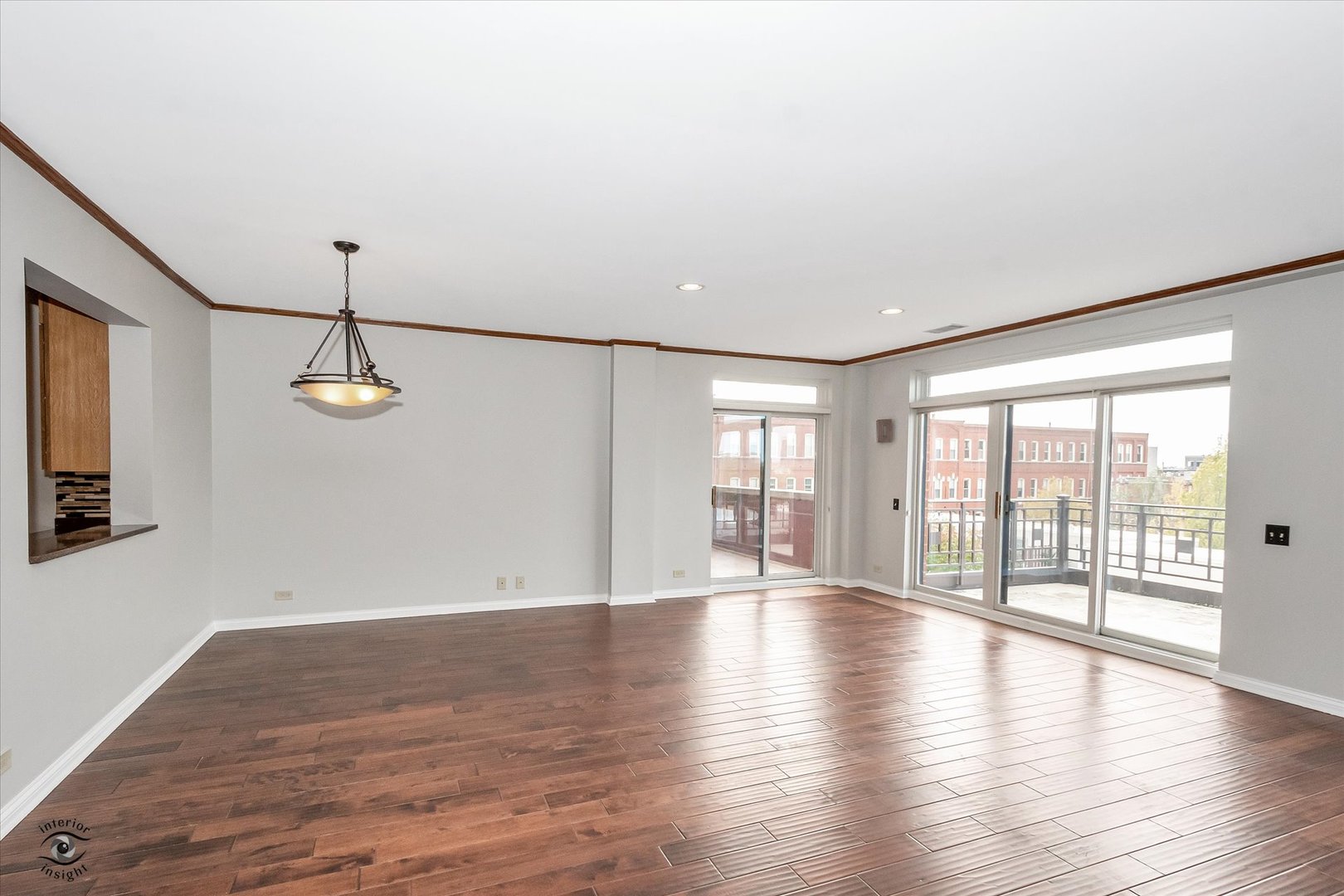 1414 North Wells Street, Unit 508 Chicago, IL 60610 - Photo 4 of 28 a view of a room with wooden floor and windows