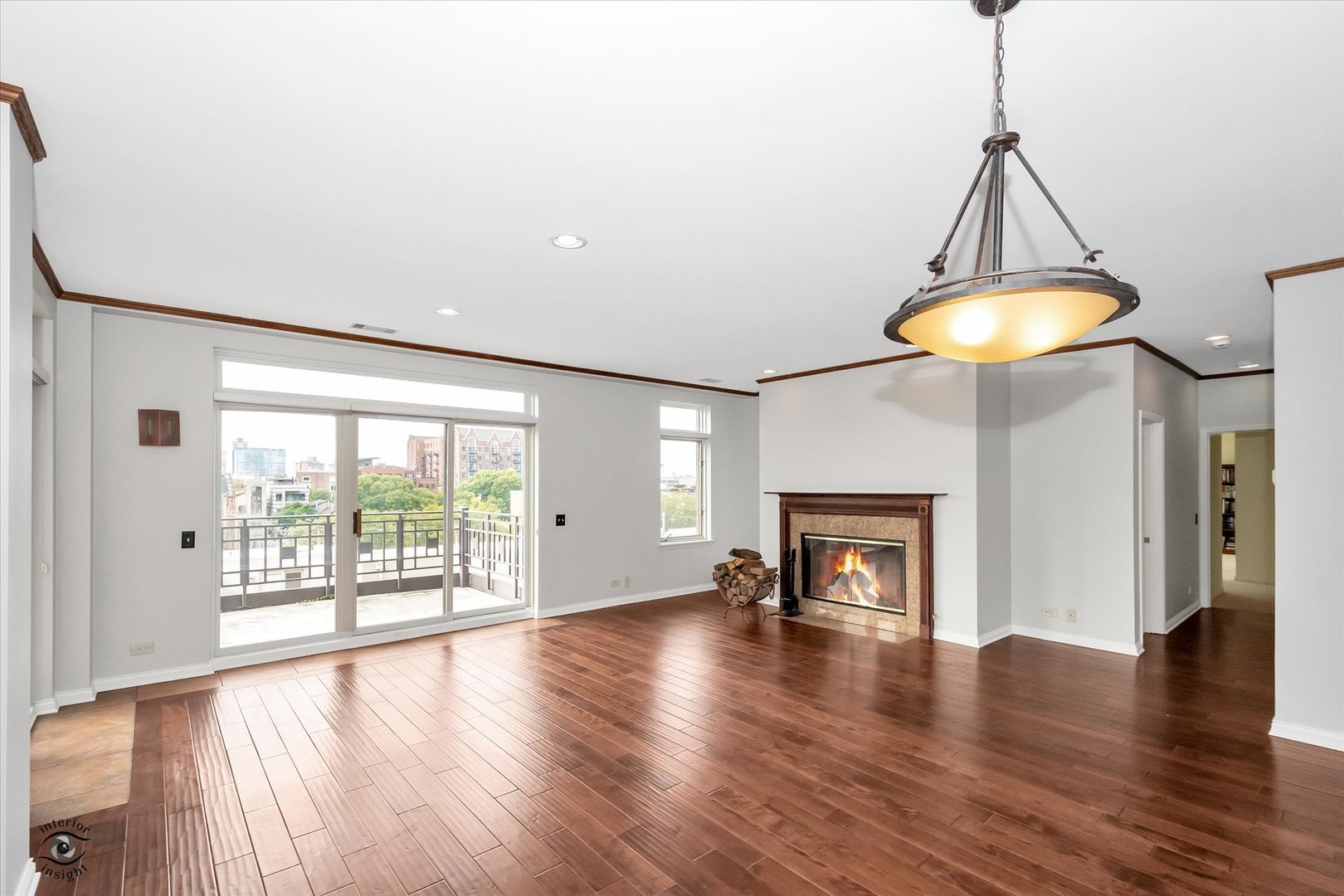 1414 North Wells Street, Unit 508 Chicago, IL 60610 - Photo 6 of 28 a view of an empty room with wooden floor and a window