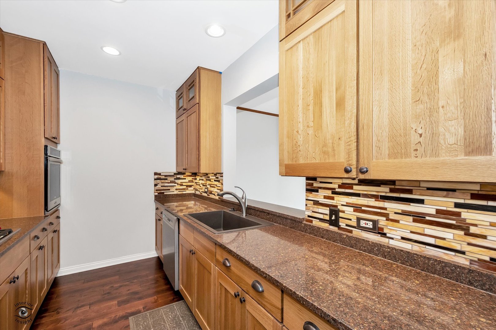 1414 North Wells Street, Unit 508 Chicago, IL 60610 - Photo 10 of 28 a kitchen with stainless steel appliances granite countertop a sink and a stove