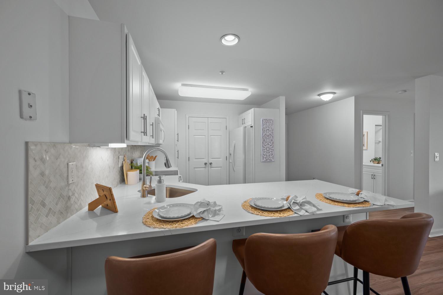 2011 Rudy Serra Drive, Unit 1C Eldersburg, MD 21784 - Photo 15 of 36 a view of a dining room with furniture