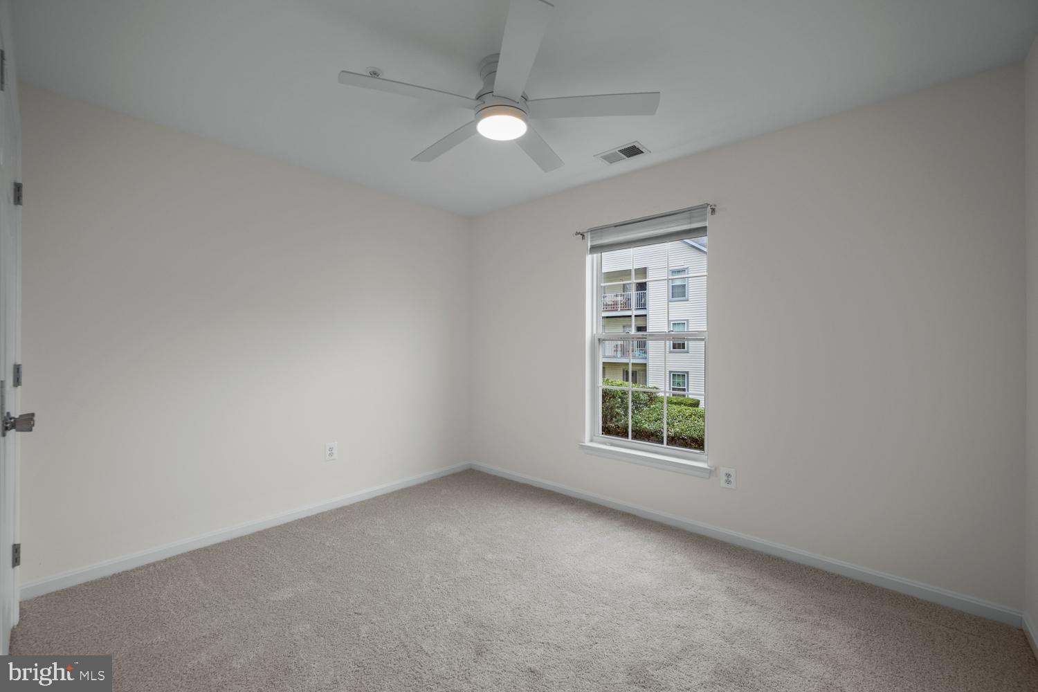 2011 Rudy Serra Drive, Unit 1C Eldersburg, MD 21784 - Photo 23 of 36 an empty room with windows and fan