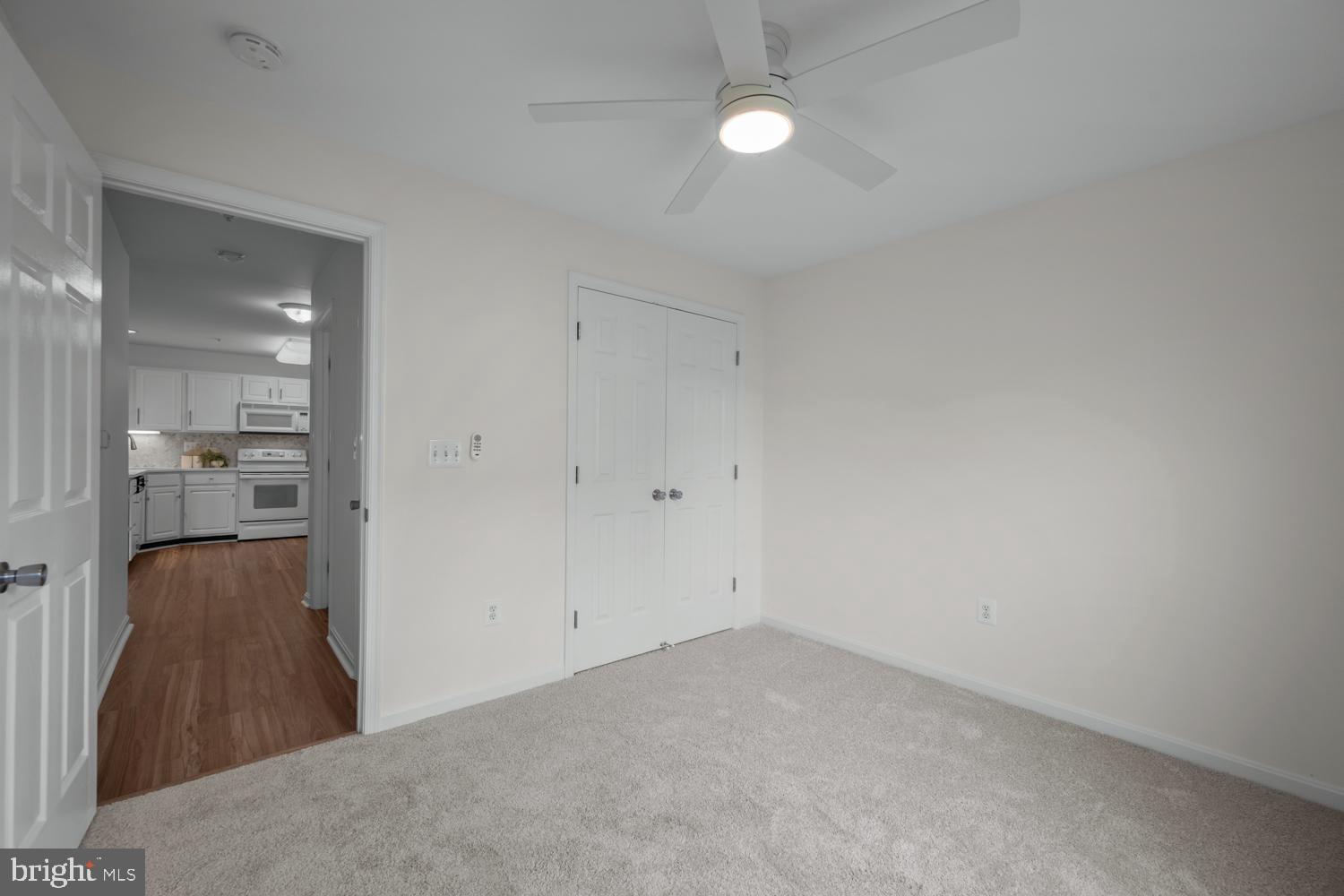 2011 Rudy Serra Drive, Unit 1C Eldersburg, MD 21784 - Photo 24 of 36 a view of a room with wooden floor and a bathroom