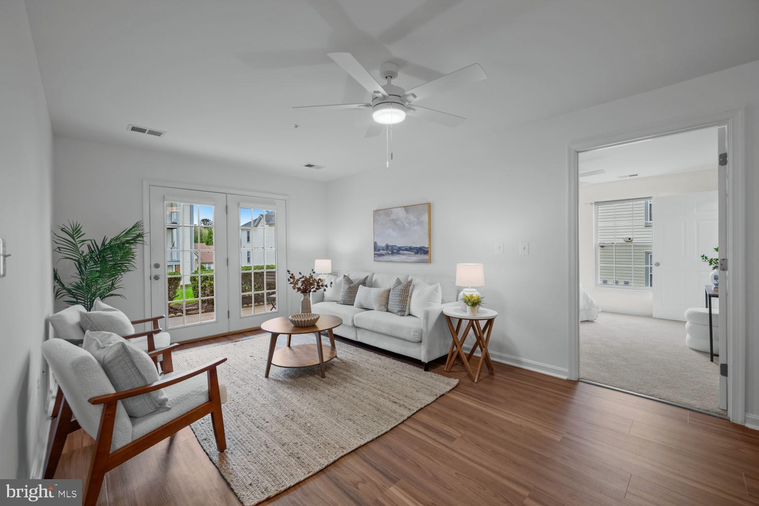 2011 Rudy Serra Drive, Unit 1C Eldersburg, MD 21784 - Photo 4 of 36 a living room with furniture and wooden floor