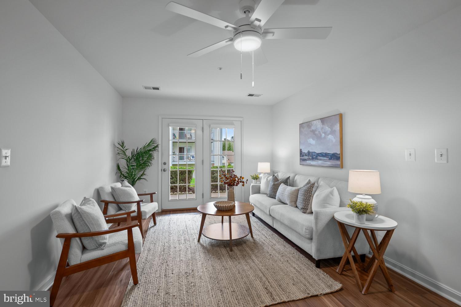 2011 Rudy Serra Drive, Unit 1C Eldersburg, MD 21784 - Photo 5 of 36 a living room with furniture and a large window