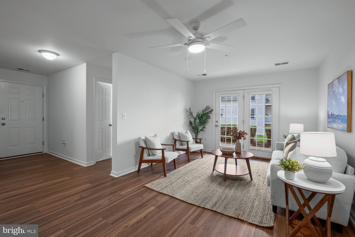 2011 Rudy Serra Drive, Unit 1C Eldersburg, MD 21784 - Photo 6 of 36 a living room with furniture and wooden floor