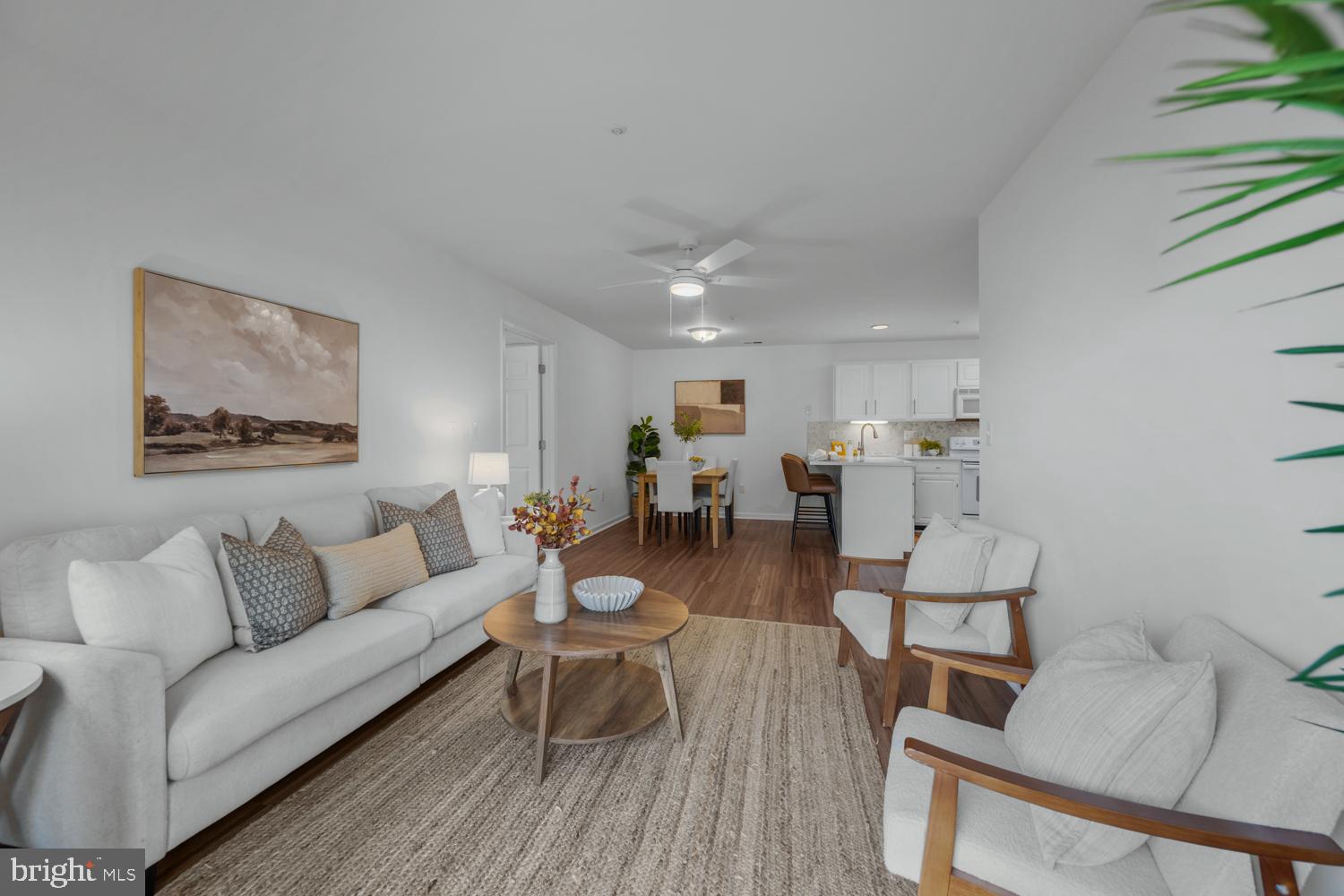 2011 Rudy Serra Drive, Unit 1C Eldersburg, MD 21784 - Photo 8 of 36 a living room with furniture and a table