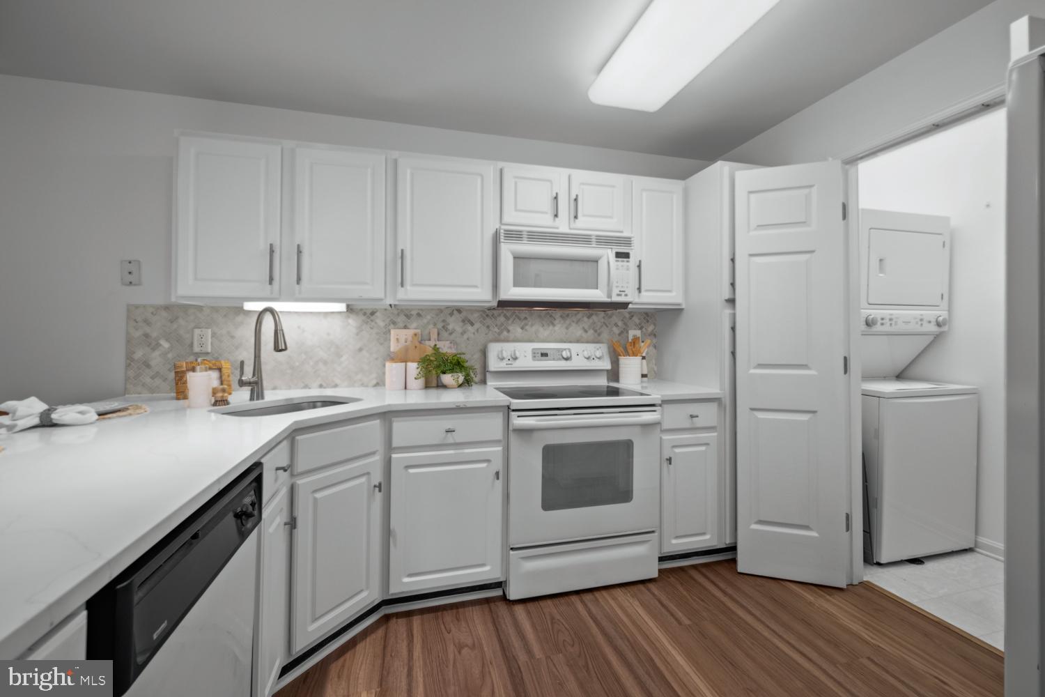 2011 Rudy Serra Drive, Unit 1C Eldersburg, MD 21784 - Photo 10 of 36 a kitchen with cabinets appliances and a counter space