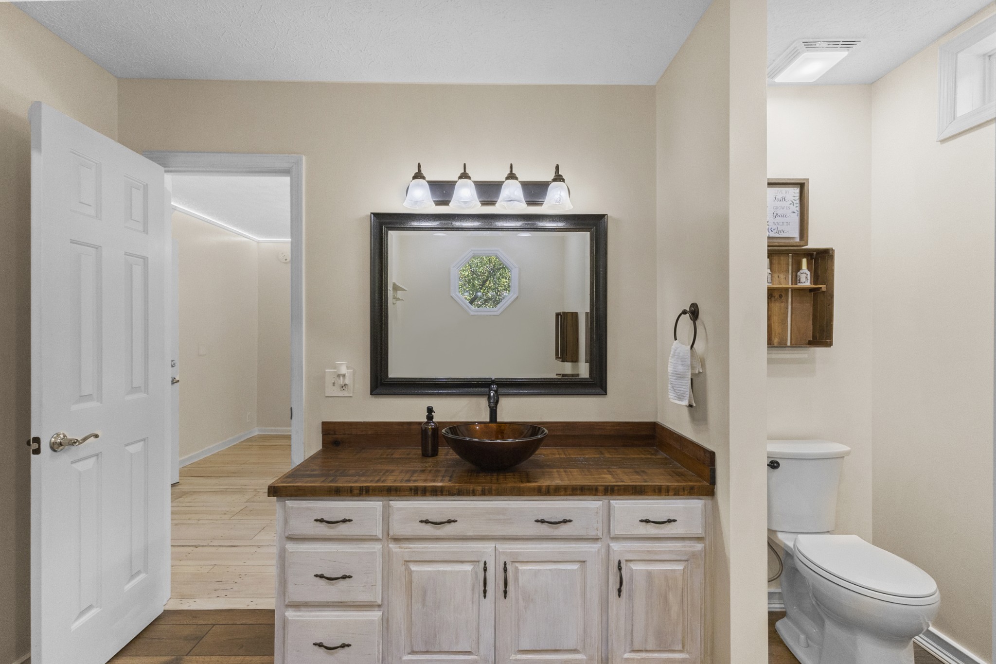 2960 Canoe Branch Road Lebanon, TN 37087 - Photo 49 of 80 a bathroom with a granite countertop sink a toilet and a mirror