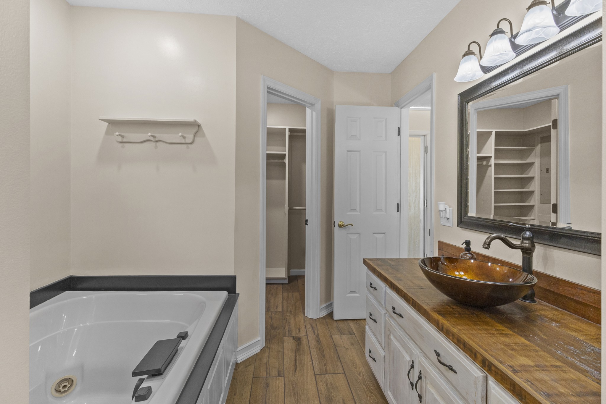 2960 Canoe Branch Road Lebanon, TN 37087 - Photo 51 of 80 a spacious bathroom with a granite countertop sink and a mirror