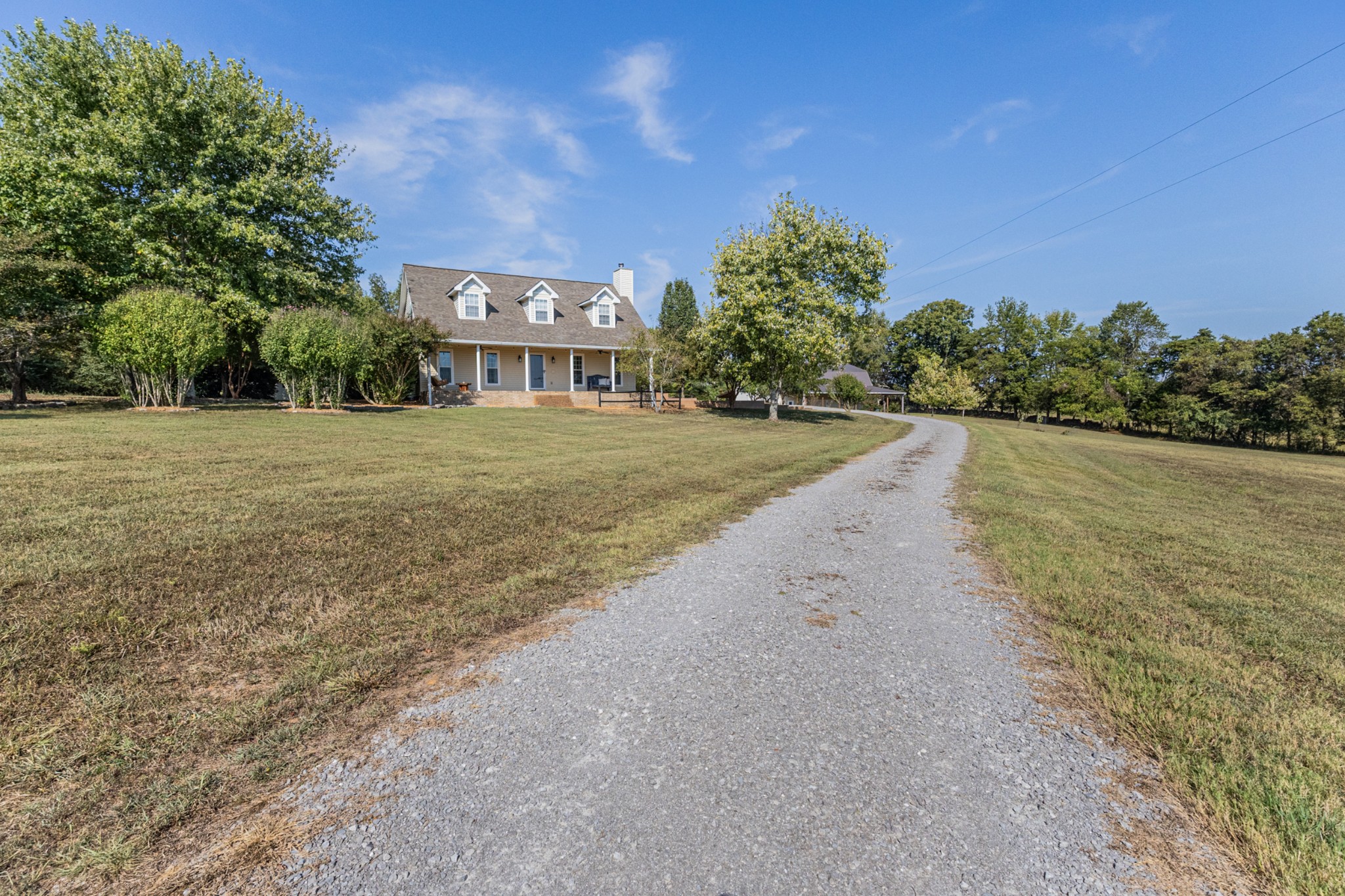 2960 Canoe Branch Road Lebanon, TN 37087 - Photo 6 of 80 a view of a big house with a big yard and palm trees