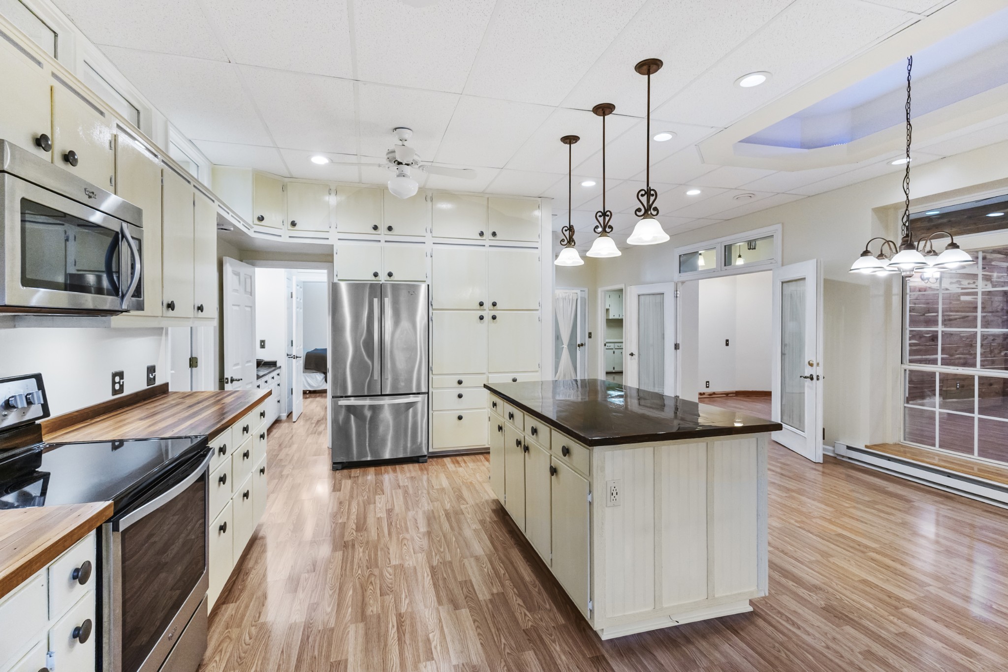 2960 Canoe Branch Road Lebanon, TN 37087 - Photo 68 of 80 a kitchen with granite countertop a sink a counter top space stainless steel appliances and cabinets