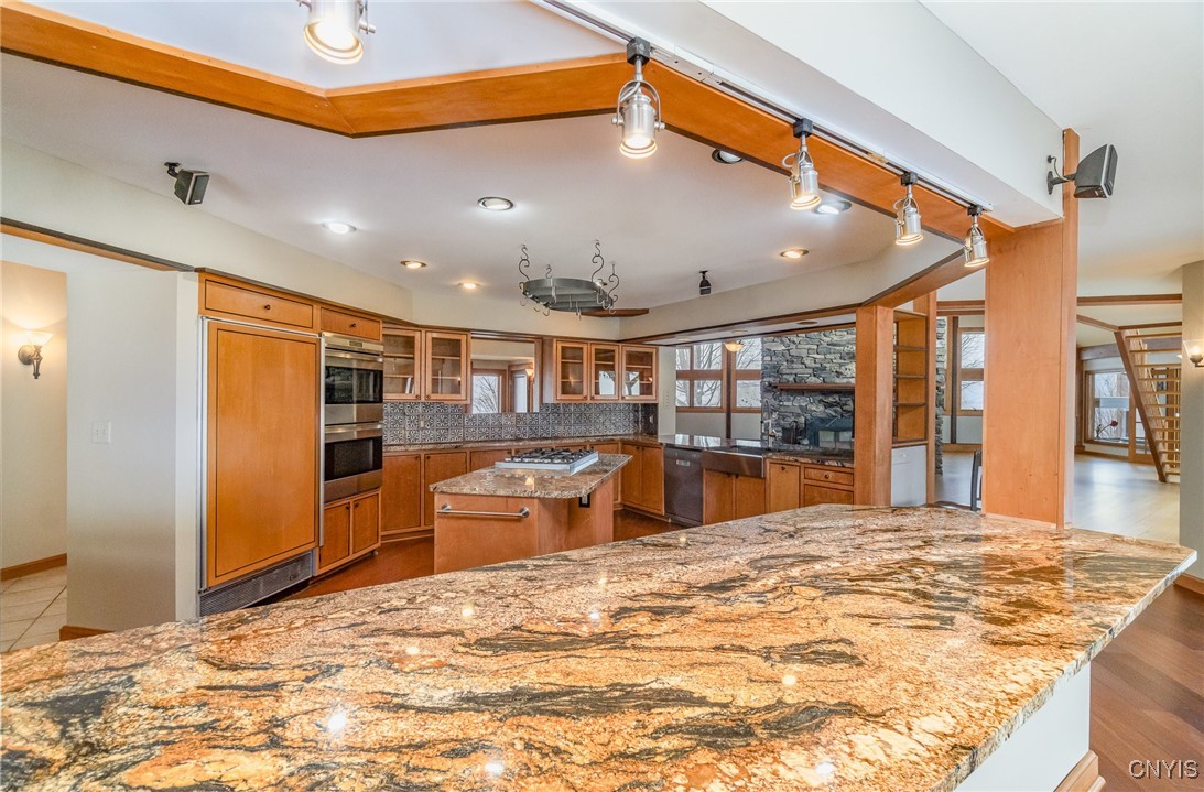 6987 Frank Long Road Pompey, NY 13078 - Photo 17 of 40 The chef's kiss kitchen is central to the first fl